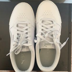 Puma - all white tennis shoes with soft foam soles. Like new, only wore once.